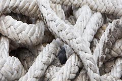 A pile of intertwining nautical ropes