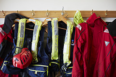 Life jackets hung up on hanging rack