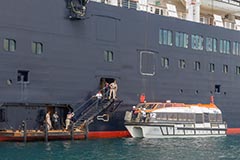 Pilots boarding a large vessel at Port of Eden