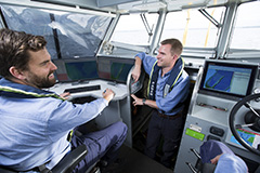 Two Port Authority employees on a survey vessel