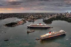 Queen Mary 2 and Queen Elizabeth pulling into Sydney Harbour