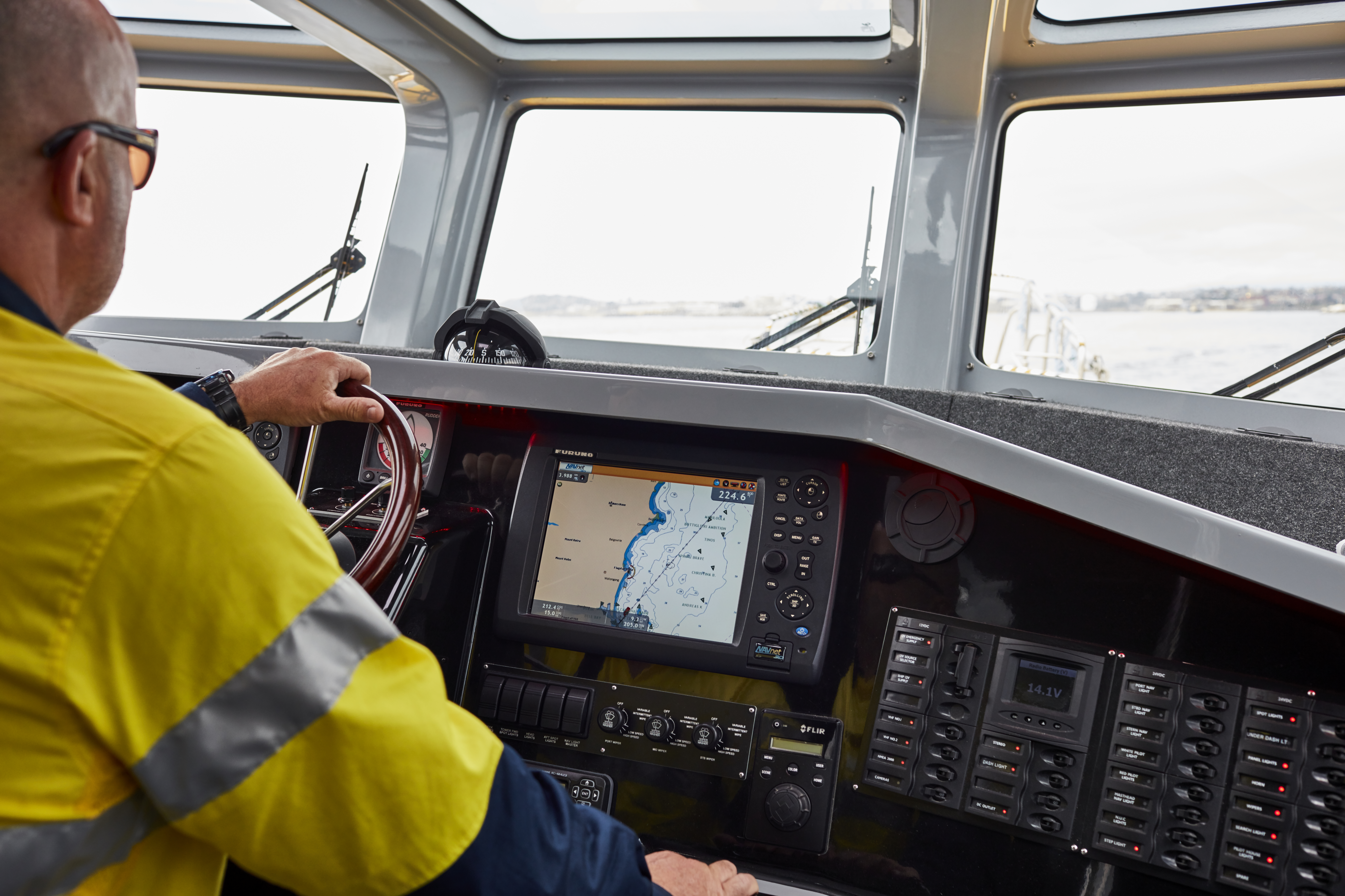 Port Authority employee piloting a vessel at Port Kembla